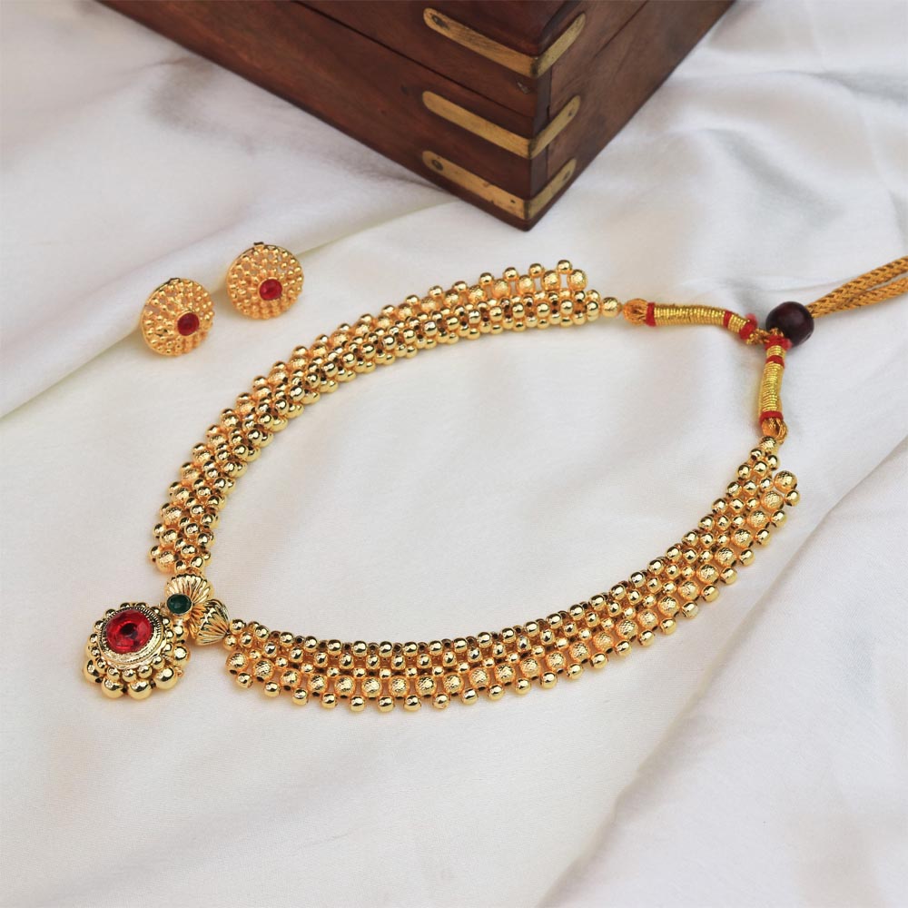  Gold pendant necklace with red stone 