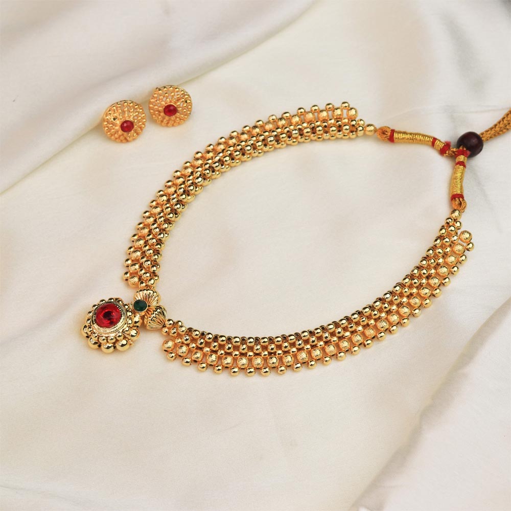  Gold pendant necklace with red stone 