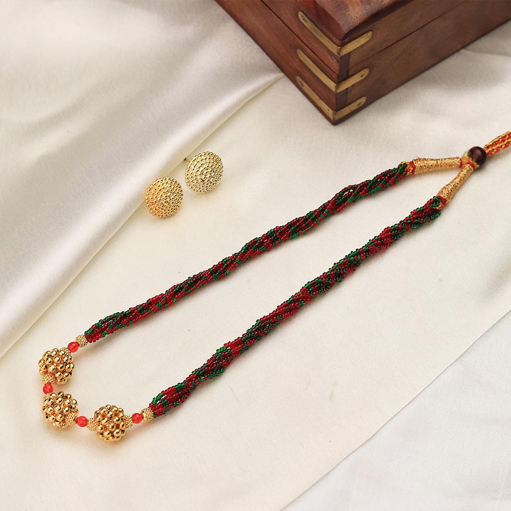 red green bead necklace with gold accents