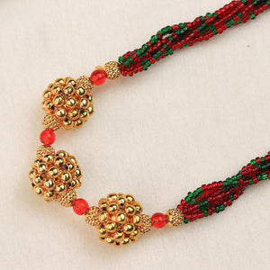red green bead necklace with gold accents