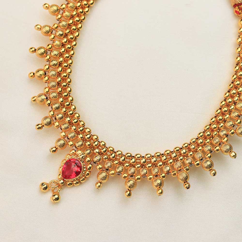 Gold kundan choker with ruby drops